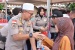 Polda Kepri Berbagi asih dengan warga Kavling Senjulung 